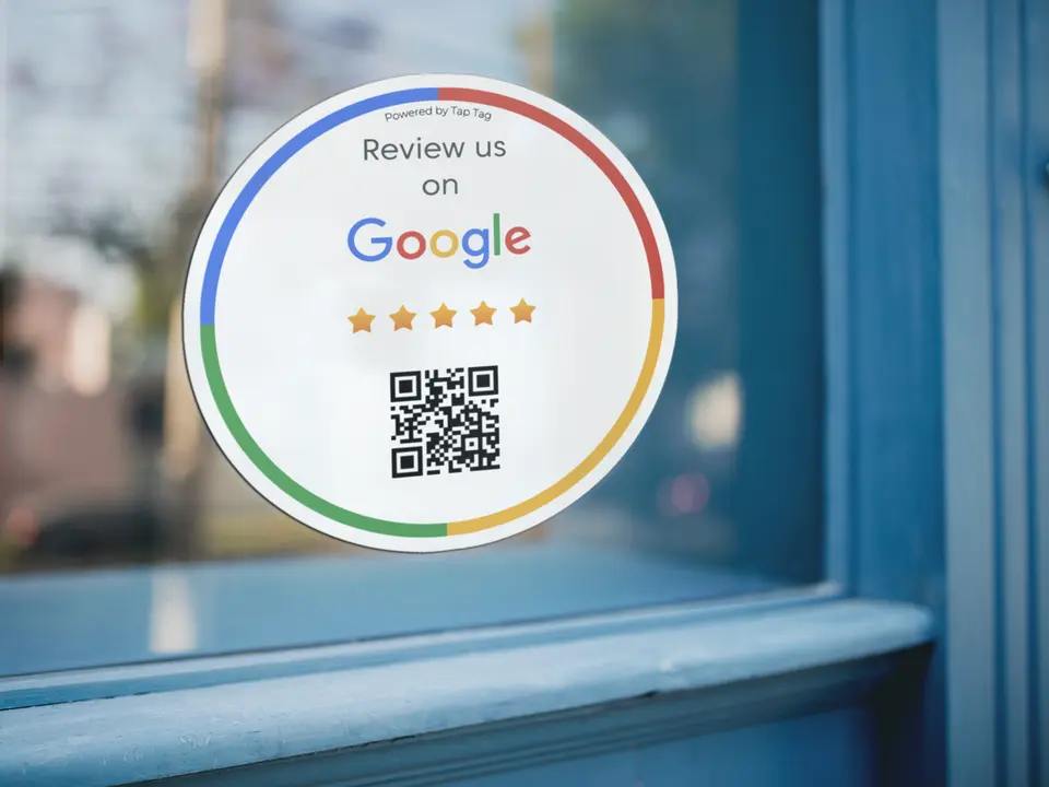 A tap-and-scan sticker placed on a storefront window